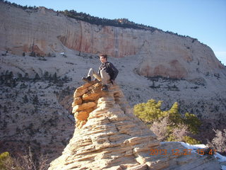 Zion National Park - Angels Landing hike - at the top - Brian sitting on a hill