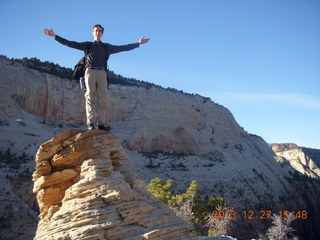 Zion National Park - Angels Landing hike - at the top - Adam sitting on a hill