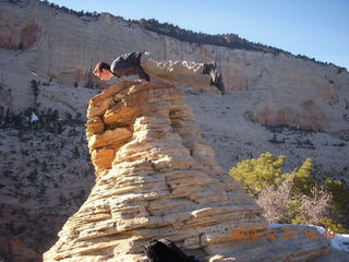 Zion National Park - Angels Landing hike - at the top - Brian balanced on a hill