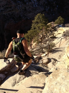 Zion National Park - Angels Landing hike - at the top - Adam climbing a hill