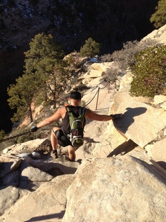 Zion National Park - Angels Landing hike - at the top - Adam sitting on a hill