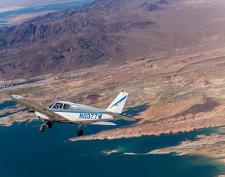 1330 8hn. N8377W in flight over Valley of Fire