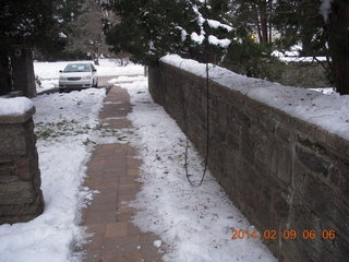 527 8j9. snow in walkway with downed wires Betsy's house