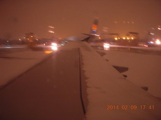 snow out the window of my airline flight