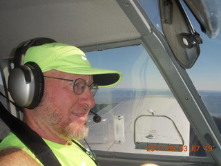 1389 8m3. Adam flying N8377W to Double Circle Ranch