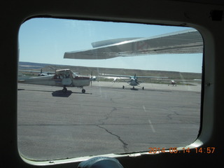 view from N51SA of airplane taxiing (is that some fellow's leg?)