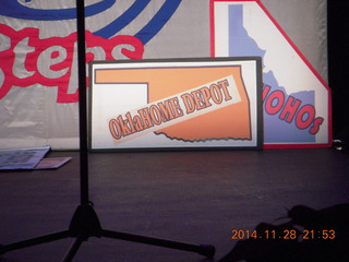 moon setting amid pine trees