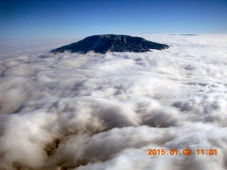 aerial - Navajo Mountain in clouds