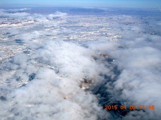 aerial - snow and clouds and canyon