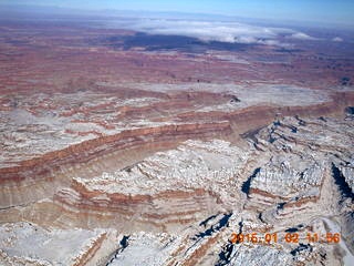 aerial - snow and clouds and canyon