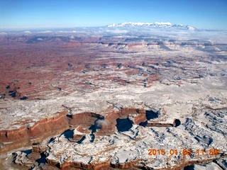 aerial - snow and clouds and canyon