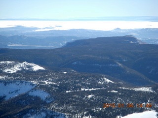 aerial - snowy Utah landscape - cloudy area to the south