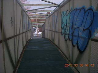 over-the-tracks bridge with graffiti