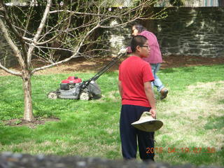 Ivan mowing the lawn with Gaby