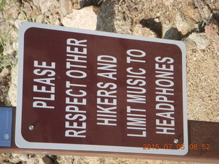 PLEASE RESPECT OTHER HIKERS AND LIMIT MUSIC TO HEADPHONES sign, no noisy speakers on hikes