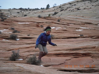 49 973. Zion National Park - layered slickrock - another person