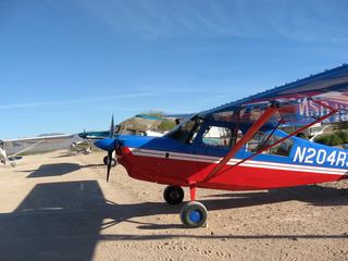 Laura flying N8377W at Alamo Lake