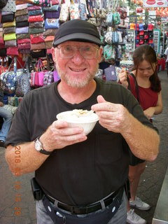 Malaysia - Kuala Lumpur food tour - Chinese temple - Adam eating sweet tofu