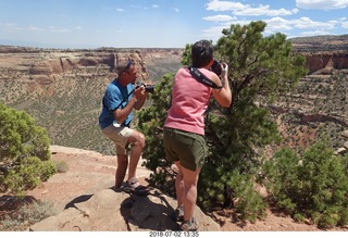 Colorado National Monument + Shaun and Karen taking a picture of a squirril