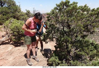 Colorado National Monument + Shaun and Karen taking a picture of a squirril