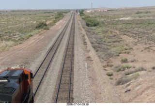 57 a03. Petrified Forest National Park - railroad tracks + train