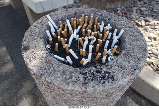 lots of cigarettes in the ashtray