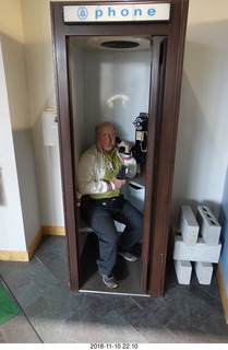 Bell Telephone museum tour with Don Barnickel - Adam in telephone booth calling cell phone