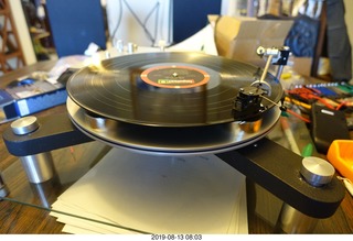 76 a0g. Trasncriptor Skeleton turntable and Vestigal tonearm playing a record