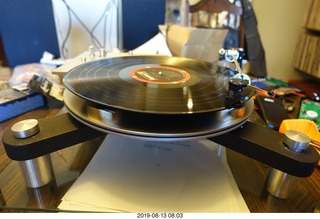 77 a0g. Trasncriptor Skeleton turntable and Vestigal tonearm playing a record