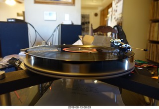 Trasncriptor Skeleton turntable and Vestigal tonearm playing a record