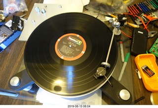 83 a0g. Trasncriptor Skeleton turntable and Vestigal tonearm playing a record