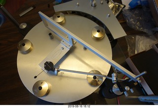 Trasncriptor Skeleton turntable and Vestigal tonearm playing a record