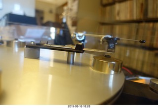 Trasncriptor Skeleton turntable and Vestigal tonearm playing a record