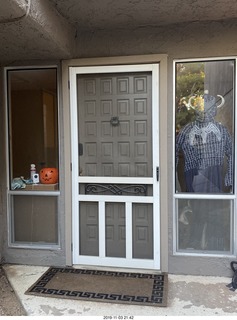 doorway with gray Spiderman costume