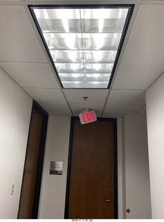 OCD hallway with tilted EXIT sign