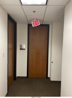 OCD hallway with tilted EXIT sign