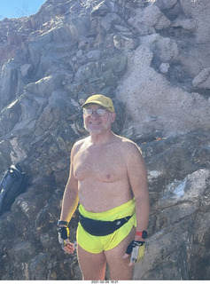 Adam shirtless atop North Mountain hike