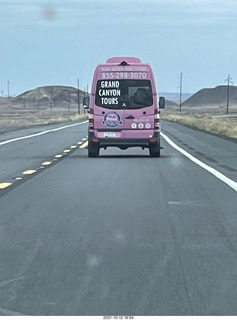 drive to Marble Canyon - pink Grand Canyon Tours bus