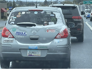 181 a18. drive on Route 89 to Flagstaff - snow and stickers on a car