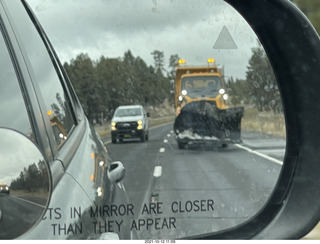 drive on Route 89 to Flagstaff - snowplow in mirror