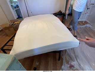 home construction - mattress coming out of the box