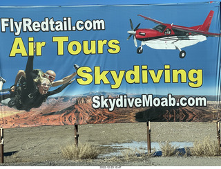 Canyonlands Field (CNY) sign for air tours and skydiving
