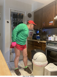 Adam dressed for bicycling in red and green for Christmas