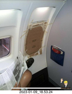 Facebook - airline window with cardboard and tape