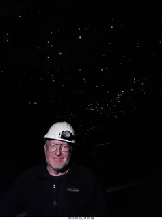 140 a1s. New Zealand - Spellbound Glowworm & Cave Tours - dark cave with glowworms + Adam