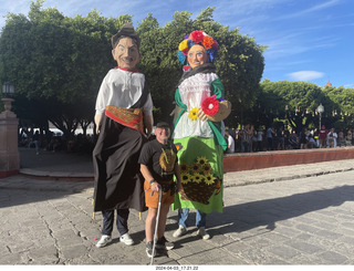 93 a24. San Miguel de Allende - Adam between tall people