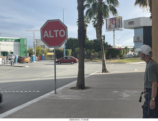 34 a24. STOP sign says ALTO