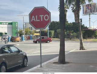 35 a24. STOP sign says ALTO