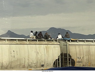 Torreon - Mexicans riding the tops of freight-train cars