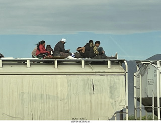 9 a24. Torreon - Mexicans riding the tops of freight-train cars